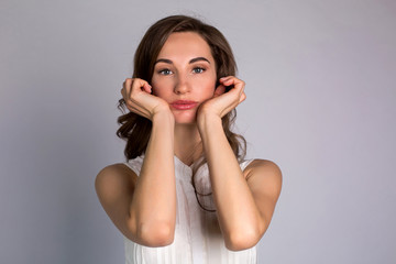 young woman makes herself a massage complex of exercises