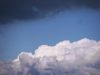 sky with soft white and blue colorful clouds at the sunset background