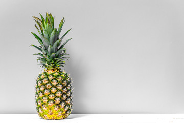 Tropical fruit, fresh pineapple on table