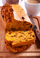 Pumpkin raisin cake, sliced on board