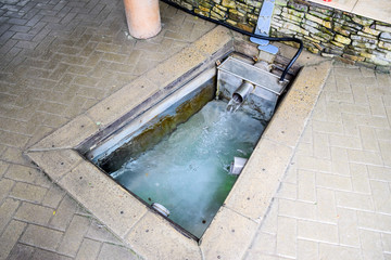 A small swimming pool with holy water from the spring. A niche in the floor for recruiting water from a source