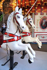 Fototapeta na wymiar Carousel horse in the amusement park. 