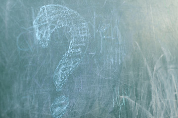 Chalkboard with wooden frame and the text question sign