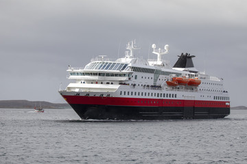 Fototapeta na wymiar Coastal ship arrives Bronnoysund in Northern Norway
