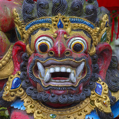 Fototapeta na wymiar Traditional Balinese statue of Barong on a street temple in Bali, Indonesia