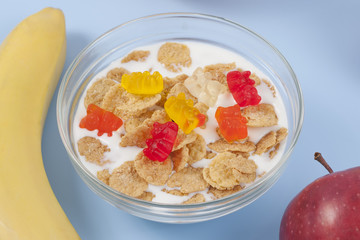 Healthy eating breakfast bowl of low calories muesli with fruits and milk