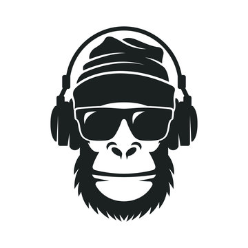 Gorilla in a knitted hat, sunglasses and headphones. Cool Monkey
