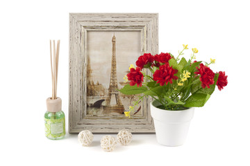 Photoframe and vase with a flower on white background