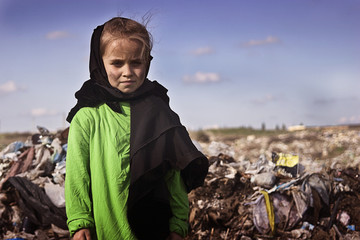 A beggar girl in rags