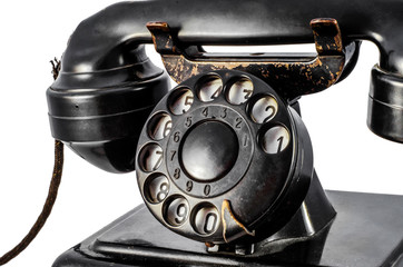 Disk dialer of old vintage black phone close-up
