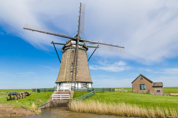 Fototapeta na wymiar Dutch windmill Het Noorden on the wadden island Texel in the Netherlands.