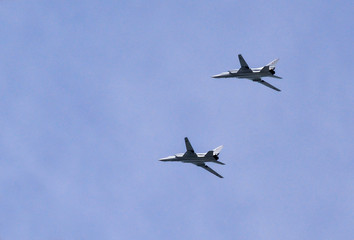Moscow, Russia - May 9, 2018: two Russian supersonic bombers Tupolev Tu-22M3 (the name of the NATO message: "Reverse Fire") in flight for the Victory Parade in Moscow on May 9. Russian Air Force.