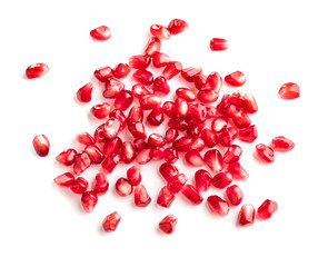 top view of heap of pomegranate seeds isolated on white background