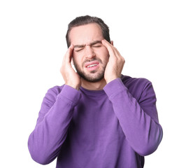 Naklejka premium Young man suffering from headache on white background
