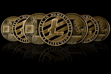 Golden Litecoins stack in row on blackground. Litecoins is one currency. of  cryptocurrency.
