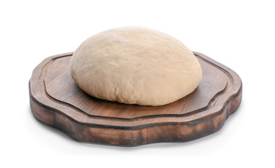 Wooden board with raw dough on white background