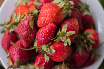 Fresh ripe strawberry on plate. Organic farm product. Sweet healthy dessert on breakfast morning. Raw vegan vegetarian healthy food diet