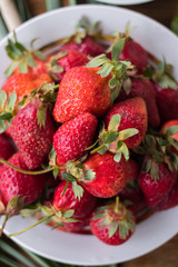 Fresh ripe strawberry on plate. Organic farm product. Sweet healthy dessert on breakfast morning. Raw vegan vegetarian healthy food diet