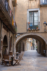 Old street with arch in Girona, Catalonia
