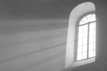 Old fashioned window with visible sun rays coming through