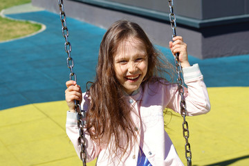 girl riding on a swing, Playground
