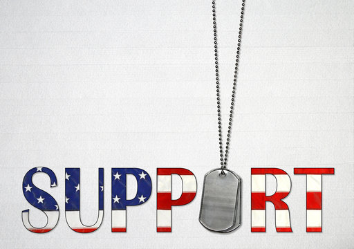 military dog tags with American flag design in the word support on light gray wood background