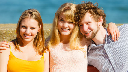 Fototapeta premium Three happy young people friends outdoor.