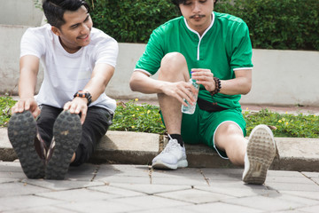 two friend warm up and exercising