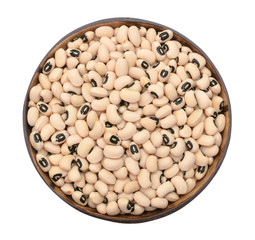 wooden bowl full of black eye beans isolated on white background