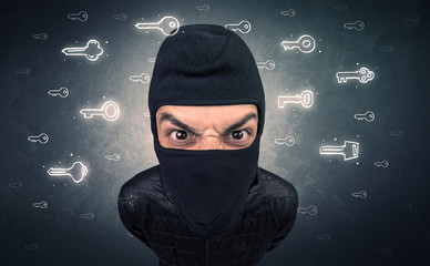 Burglar standing with tools in his hand.