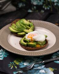 poached egg, toast, wholemeal bread, avocado, floral background