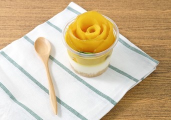 Cup of Delicious Cheesecake with Ripe Mango