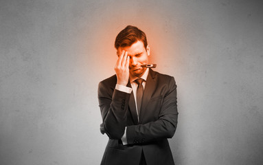 Fever businessman with burning red head concept
