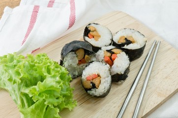 Veggie Sushi Rolls or Vegetable Maki on Wooden Board