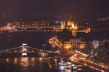 Fotobehang Kettingbrug Beautuful super-wide angle aerial night view of Budapest, Hungary, with Danube river, Parliament building and scenery beyond the city, seen from observation point of Gellert Hill