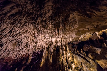 Millions Years Old mineral formation on a cave ceiling known as Stalactites