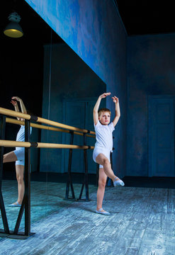 boy ballet dancer doing exercise at  dance class