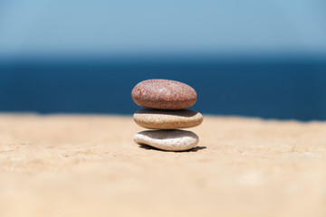 Fototapeta na wymiar stack of pebbles in the middle symbolizes balance and harmony