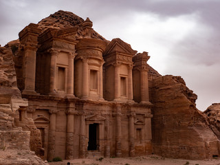 Sunlight lights up the front of the Monestary at Petra Jordan