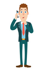 Businessman talking on mobile phone and standing with his finger to his lips