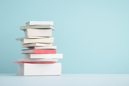 Stack of mini old books.