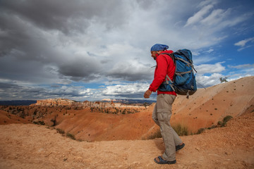 Fototapeta premium Hiker visits Bryce canyon National park in Utah, USA