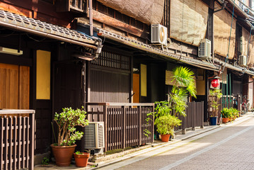 Facades of buildings in japanese style in Kyoto, Japan. Copy space for text.
