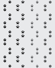 Seamless pattern of footprint of paws on a gray  background