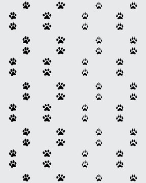 Seamless pattern of footprint of paws on a gray  background