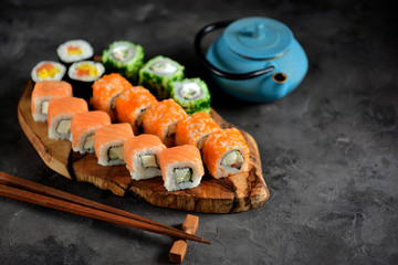 Delicious sushi with salmon, soft cheese and tobiko caviar. Japanese food.
