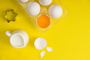 Baking flat lay with eggs milk spices cookie cutter