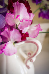 Obraz na płótnie Canvas Sweet pea flowers in a vase, beautiful still life