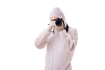 Forensic specialist in protective suit taking photos on white
