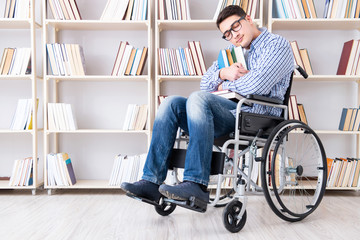 Fototapeta na wymiar Disabled student studying in the library